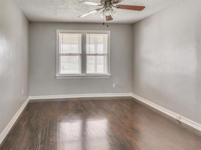 1817 NW 32nd St, Oklahoma City, OK 73118 - spare room featuring dark wood-style floors, ceiling fan, a textured ceiling, and baseboards