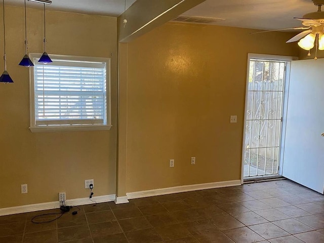 1817 NW 32nd St, Oklahoma City, OK 73118 - unfurnished room with a healthy amount of sunlight, tile patterned flooring, visible vents, and a ceiling fan