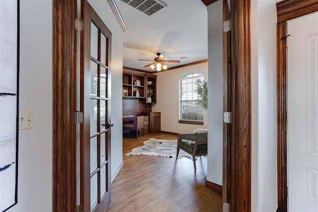 16513 Fenwick Blvd, Edmond, OK 73012 - corridor featuring an office area, wood finished floors, french doors, and ornamental molding