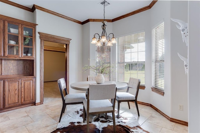 16513 Fenwick Blvd, Edmond, OK 73012 - dining area featuring a chandelier, crown molding, and baseboards