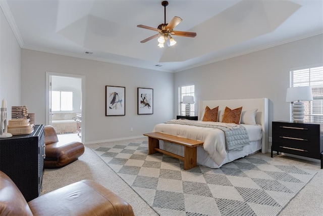 16513 Fenwick Blvd, Edmond, OK 73012 - bedroom featuring light colored carpet, crown molding, a raised ceiling, baseboards, and connected bathroom