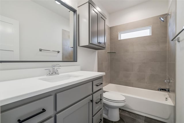 bathroom with toilet, vanity, and shower / bathing tub combination