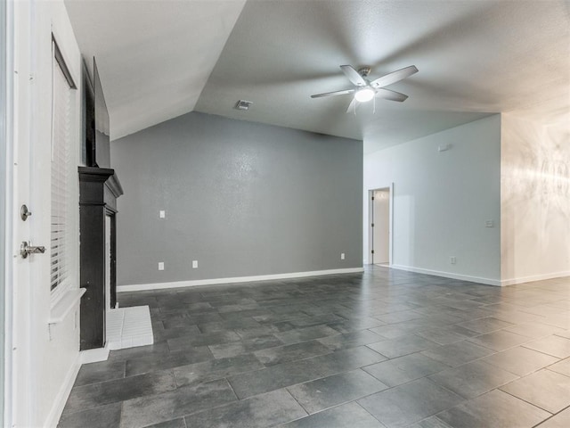 unfurnished living room with lofted ceiling, a ceiling fan, visible vents, and baseboards