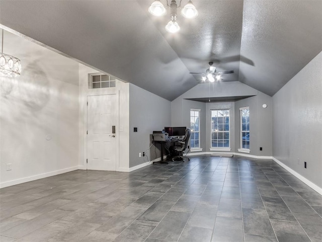 unfurnished office with lofted ceiling, ceiling fan, baseboards, and a textured ceiling