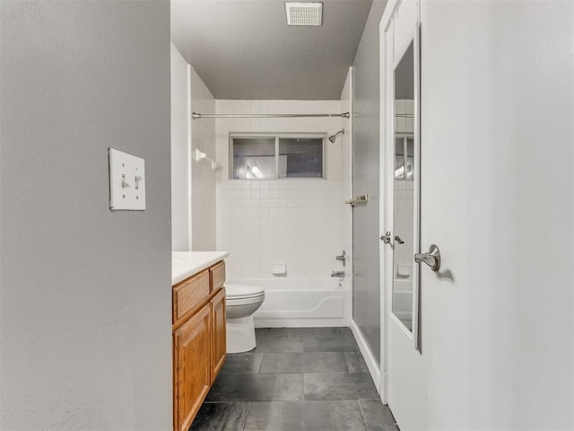 bathroom with washtub / shower combination, visible vents, vanity, and toilet