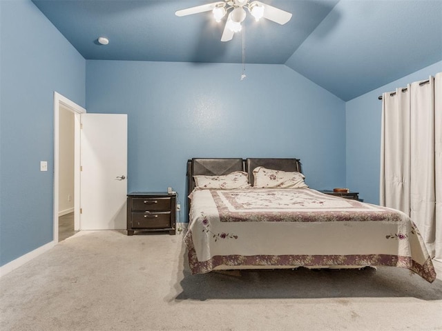 carpeted bedroom with vaulted ceiling, ceiling fan, and baseboards