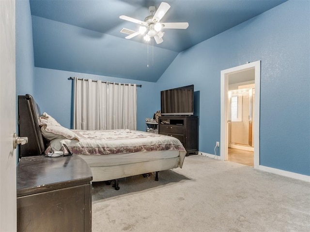 bedroom featuring light carpet, baseboards, connected bathroom, ceiling fan, and vaulted ceiling