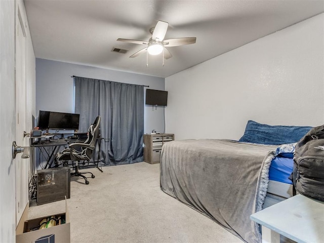 bedroom featuring light carpet, visible vents, and a ceiling fan