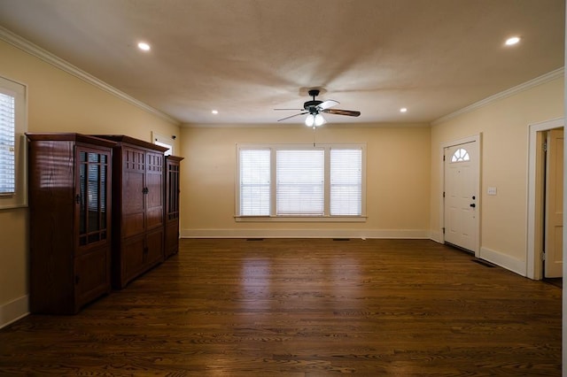 foyer featuring dark wood-style floors, baseboards, ornamental molding, and a ceiling fan