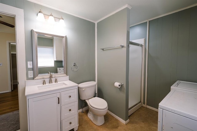 bathroom with a stall shower, washing machine and dryer, ornamental molding, and vanity