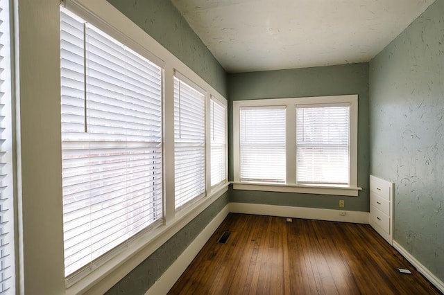 unfurnished sunroom with visible vents