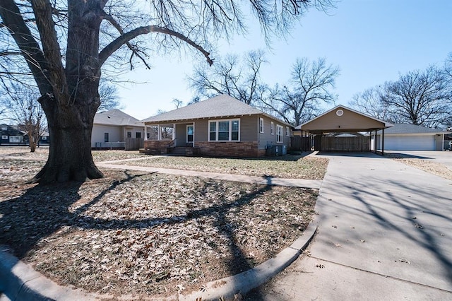 view of front of property with stone siding and concrete driveway