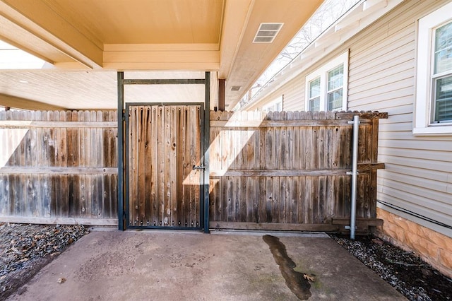 view of gate featuring fence