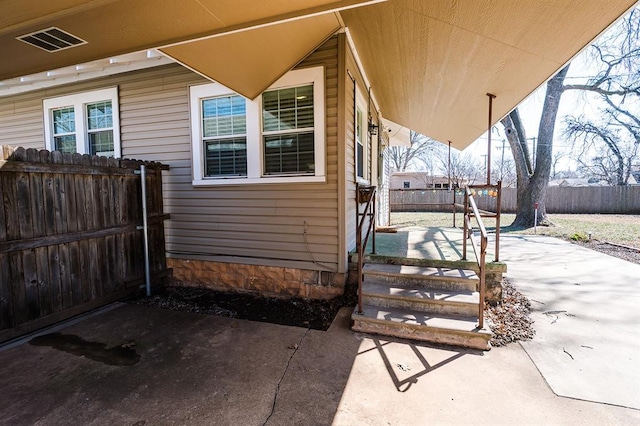 view of patio / terrace with visible vents and fence