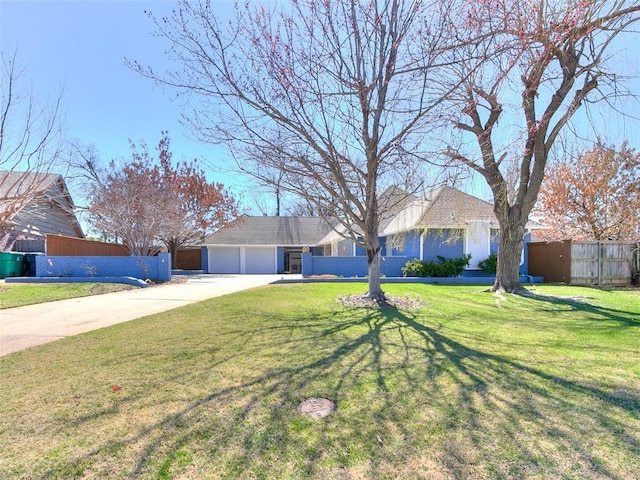 ranch-style home with an attached garage, driveway, a front lawn, and fence