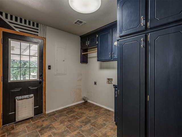 clothes washing area featuring hookup for a washing machine, visible vents, baseboards, cabinet space, and electric dryer hookup