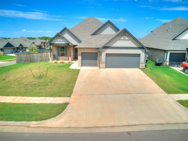 craftsman inspired home featuring a garage, brick siding, driveway, roof with shingles, and a front yard