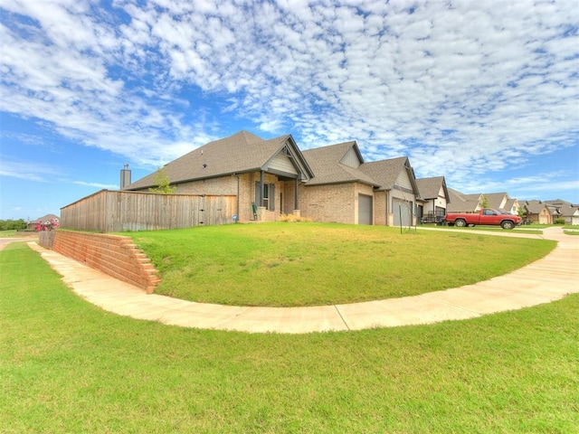 exterior space featuring an attached garage and fence