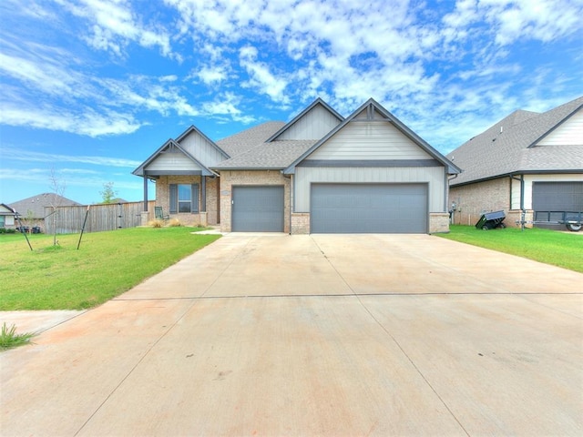 craftsman-style home with a front lawn, an attached garage, and brick siding