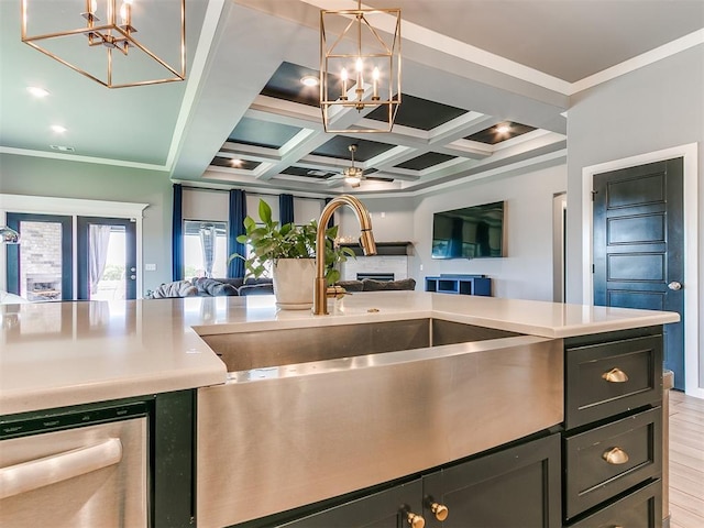 kitchen featuring coffered ceiling, open floor plan, beamed ceiling, light countertops, and ceiling fan with notable chandelier