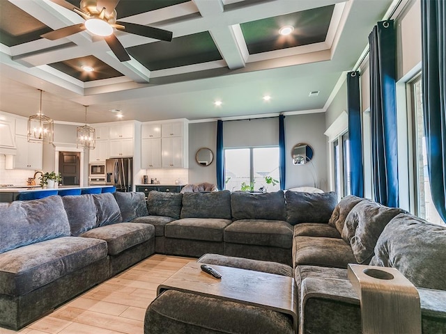 living area with light wood-style flooring, coffered ceiling, crown molding, and beamed ceiling