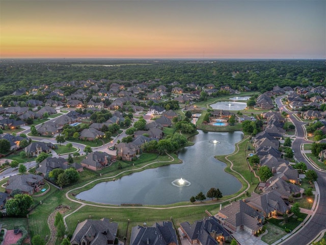 bird's eye view featuring a residential view and a water view