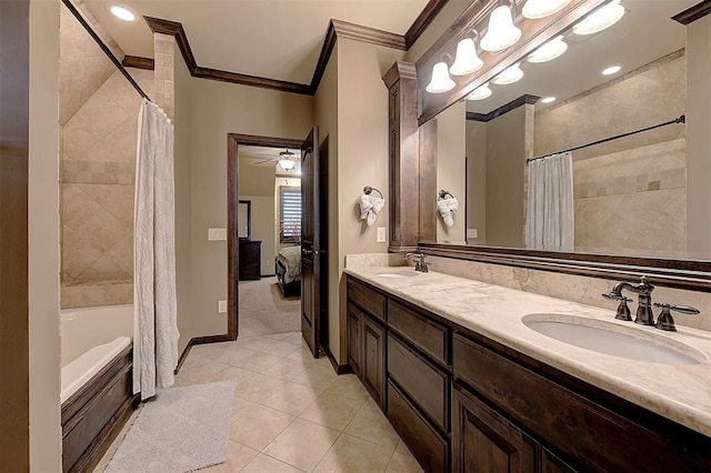 ensuite bathroom featuring tile patterned flooring, ornamental molding, double vanity, and a sink