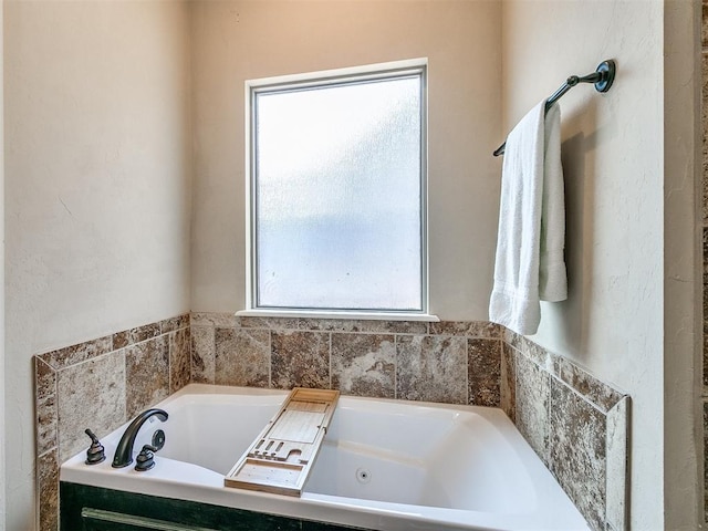 full bathroom with a whirlpool tub