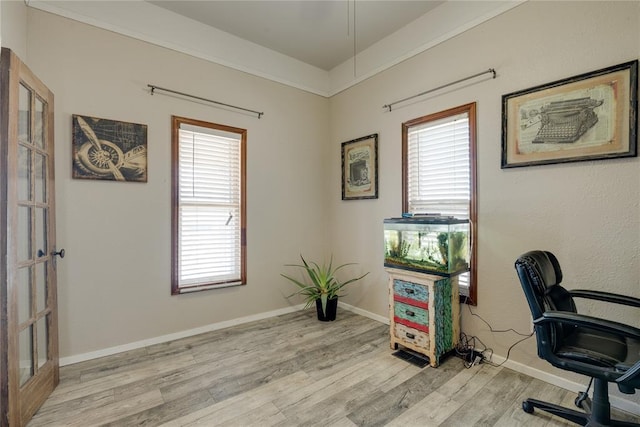 office featuring light wood-style flooring and baseboards