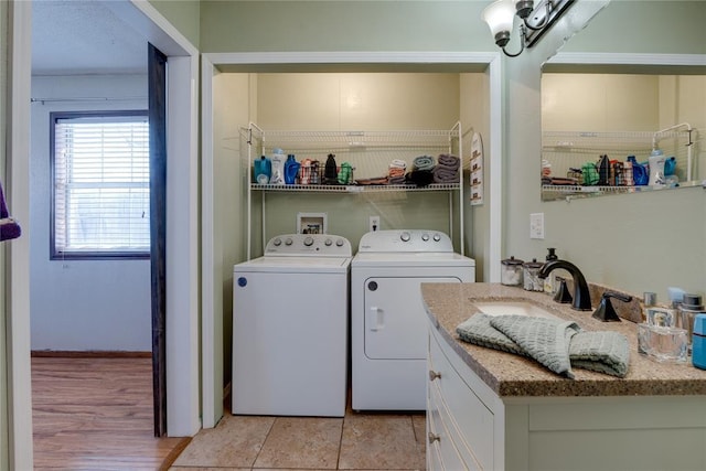 laundry room featuring a sink, laundry area, and washer and dryer