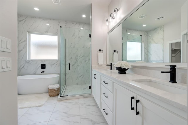full bath featuring marble finish flooring, healthy amount of natural light, a marble finish shower, a soaking tub, and recessed lighting