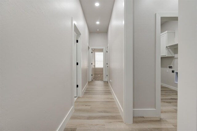 hallway featuring recessed lighting, light wood-type flooring, and baseboards