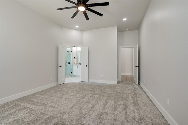 7112 NW 154th St, Edmond, OK 73013 - unfurnished bedroom featuring light carpet, ensuite bath, recessed lighting, baseboards, and ceiling fan
