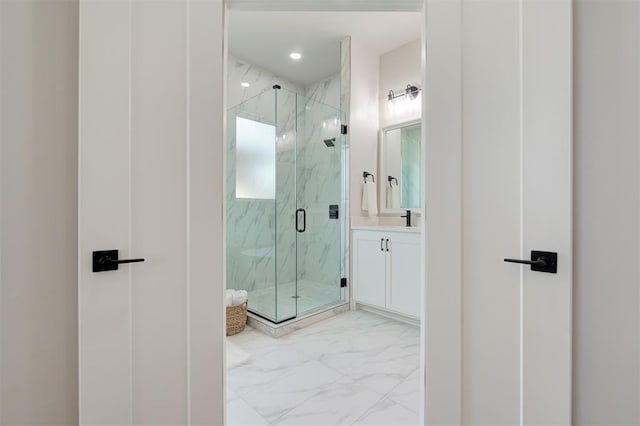 7112 NW 154th St, Edmond, OK 73013 - full bath featuring marble look tiles, vanity, a marble finish shower, and recessed lighting