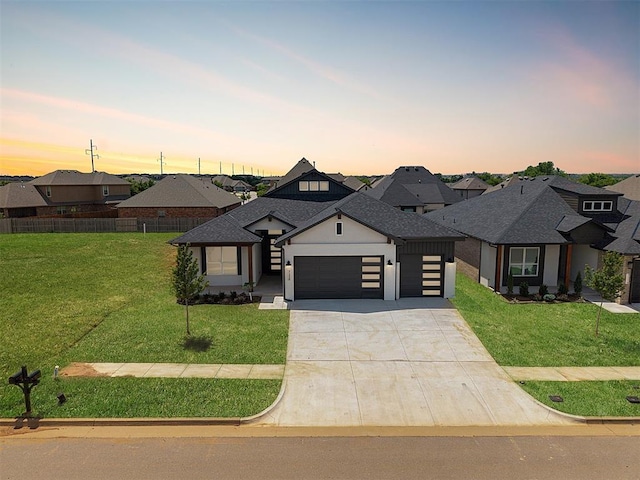 7112 NW 154th St, Edmond, OK 73013 - view of front of house with an attached garage, concrete driveway, a shingled roof, and a residential view