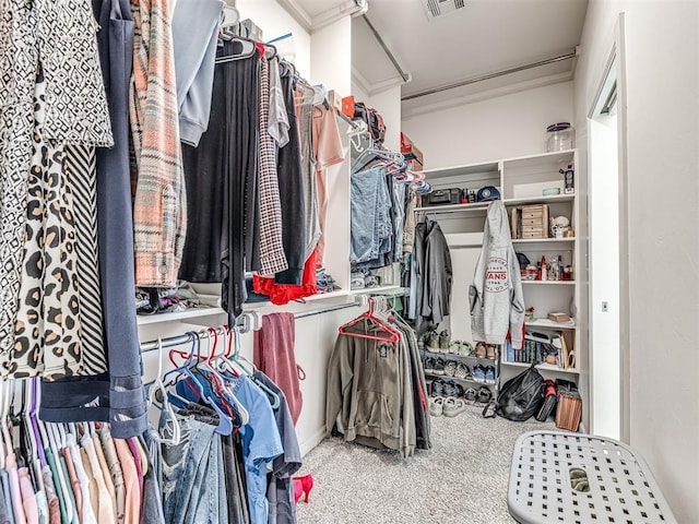 walk in closet with carpet floors and visible vents