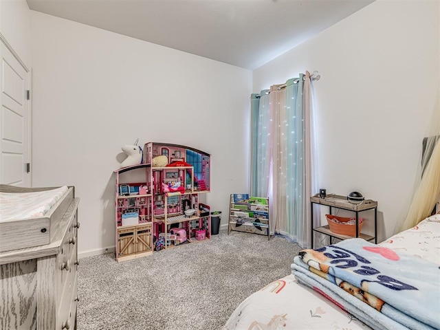 bedroom featuring baseboards and carpet flooring