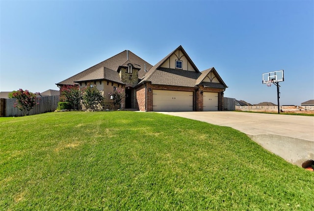 view of front of property featuring brick siding, a shingled roof, concrete driveway, a front yard, and fence