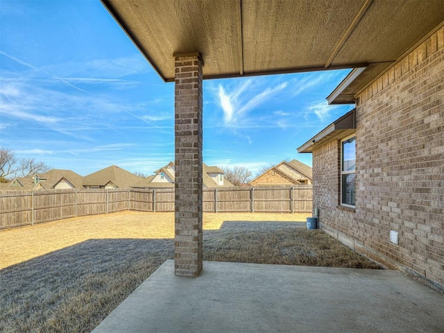 view of yard with a patio area and a fenced backyard