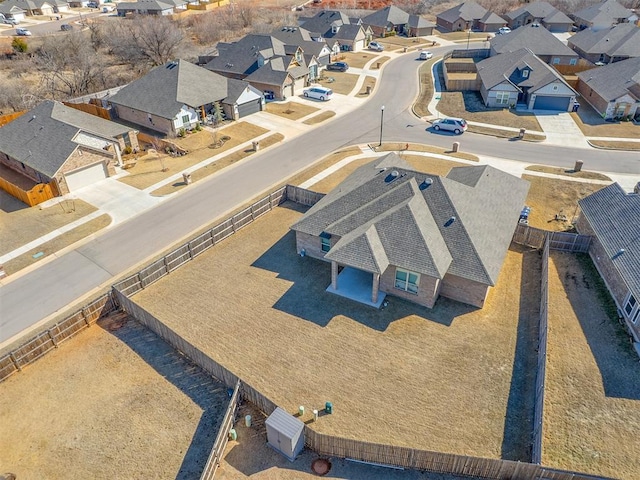 birds eye view of property with a residential view