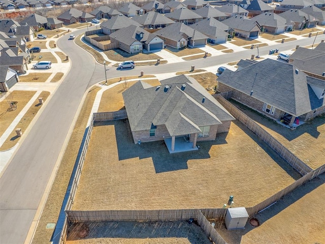 birds eye view of property with a residential view