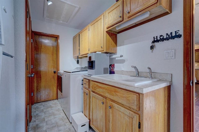 laundry area featuring cabinet space and a sink