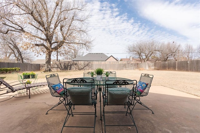 view of patio / terrace with outdoor dining space and a fenced backyard