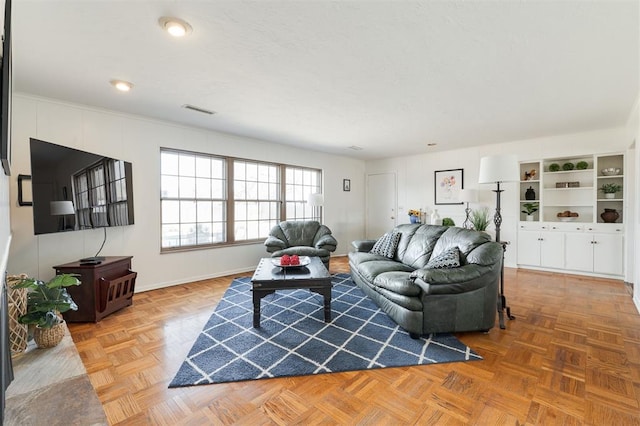 living room featuring visible vents