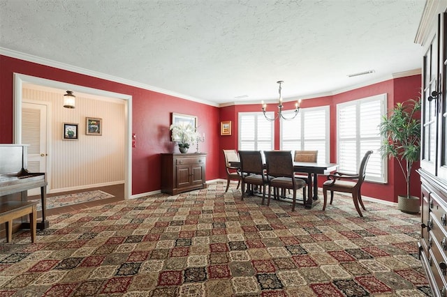 dining space with a textured ceiling, visible vents, dark colored carpet, and crown molding