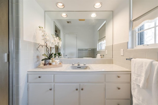 bathroom featuring recessed lighting, visible vents, and vanity