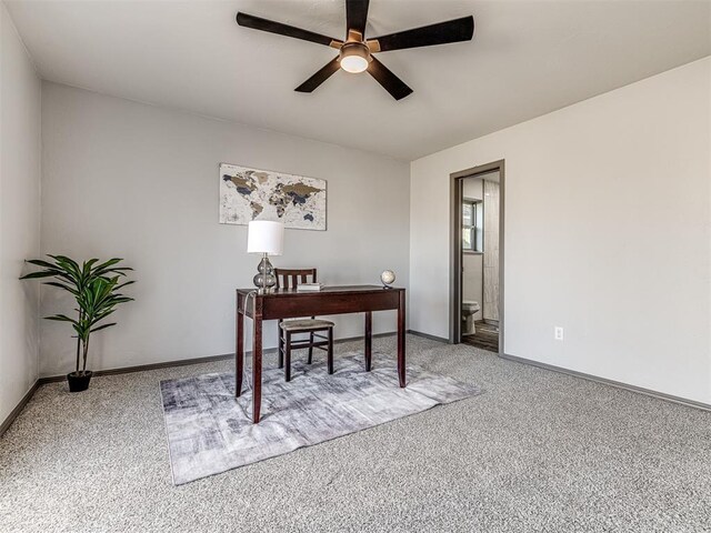 office area featuring carpet, a ceiling fan, and baseboards