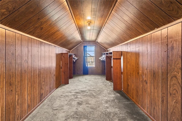 bonus room featuring wooden ceiling, wooden walls, vaulted ceiling, and carpet flooring