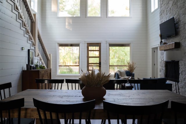 dining area with a towering ceiling