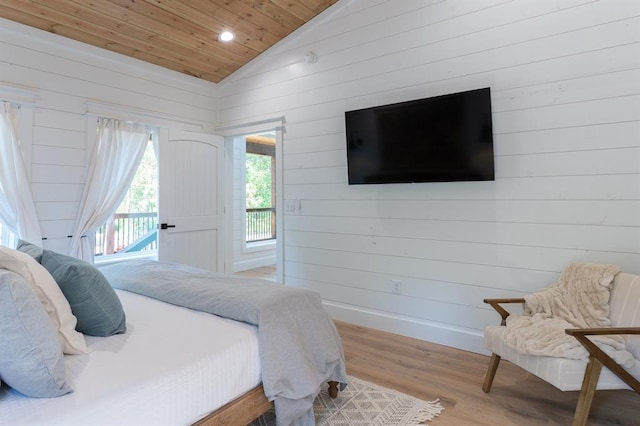 bedroom featuring baseboards, wood ceiling, wood finished floors, access to outside, and vaulted ceiling